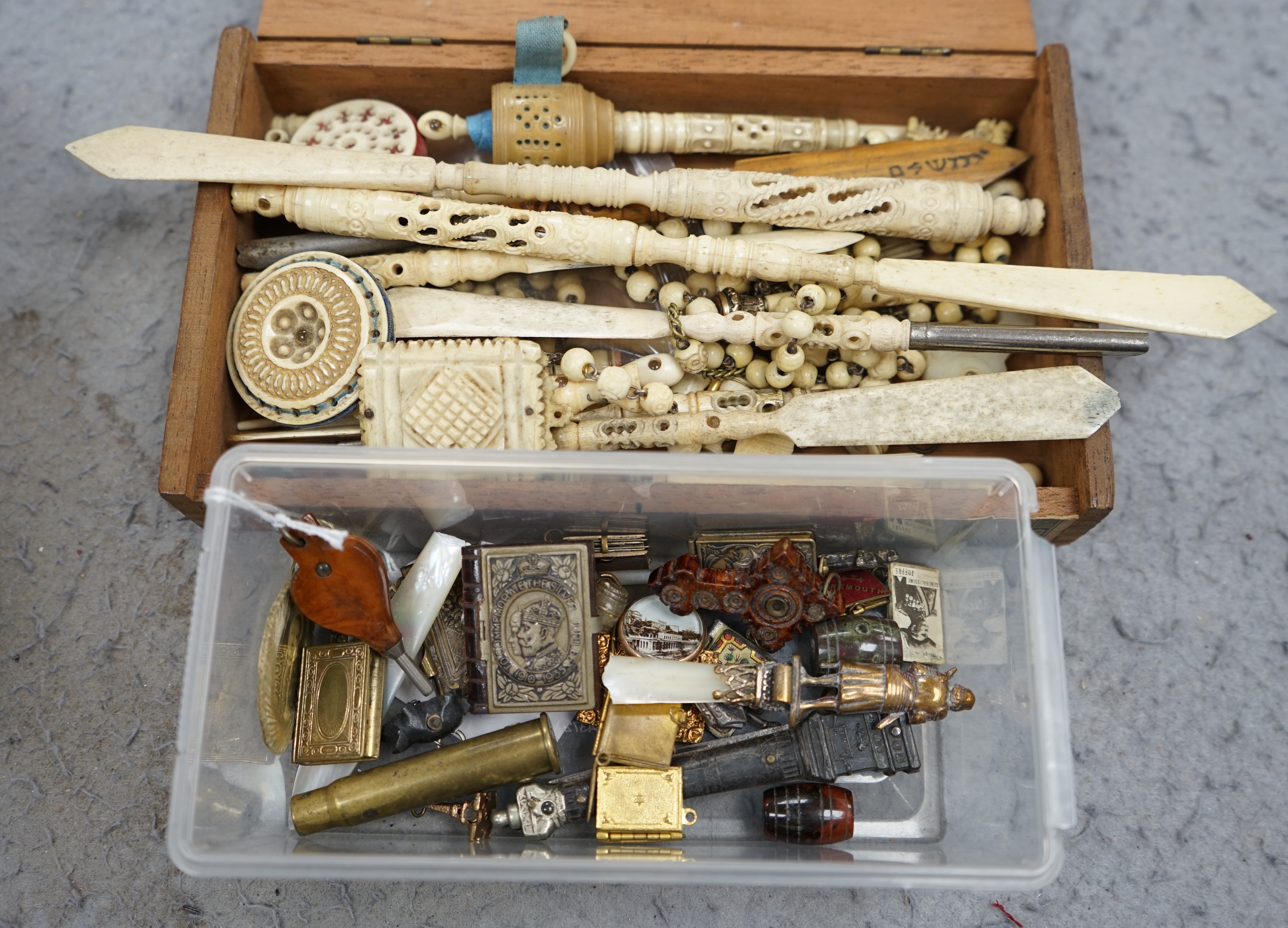 A collection of carved bone Stanhope letter openers, sewing items, miniature book pendants and charms and general novelties, longest Stanhope letter opener 23cm. Condition - poor to fair